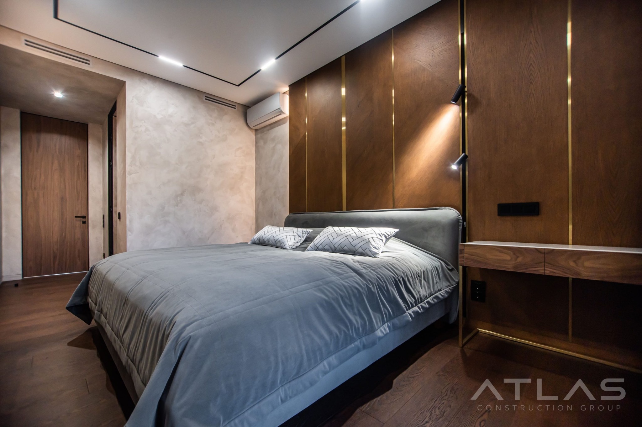 Bedroom with walnut feature wall and custom nightstand